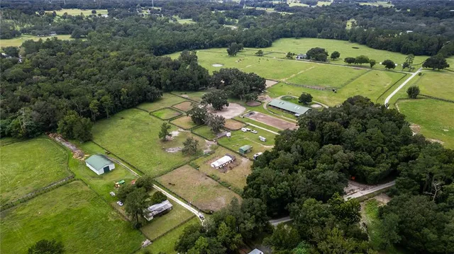 an aerial view of a pool yard swimming pool and outdoor seating