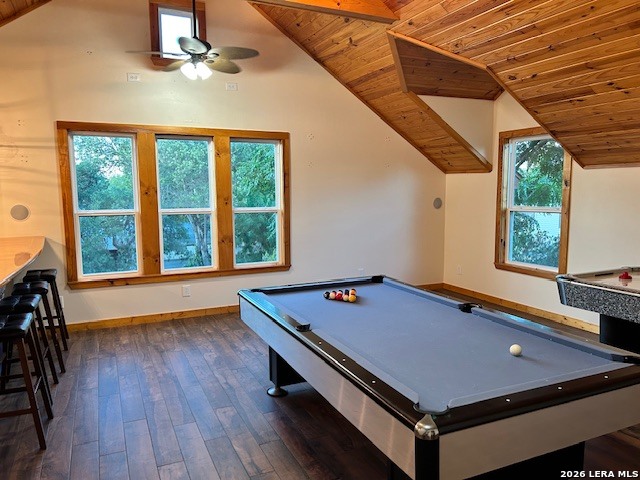 a room with pool table and windows