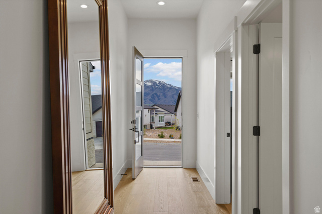 3349 Oxford Loop Morgan, UT 84050 - Photo 22 of 47 Doorway with wood finished floors, a mountain view, and recessed lighting