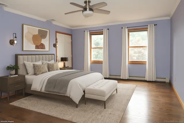 a bedroom with a bed and window