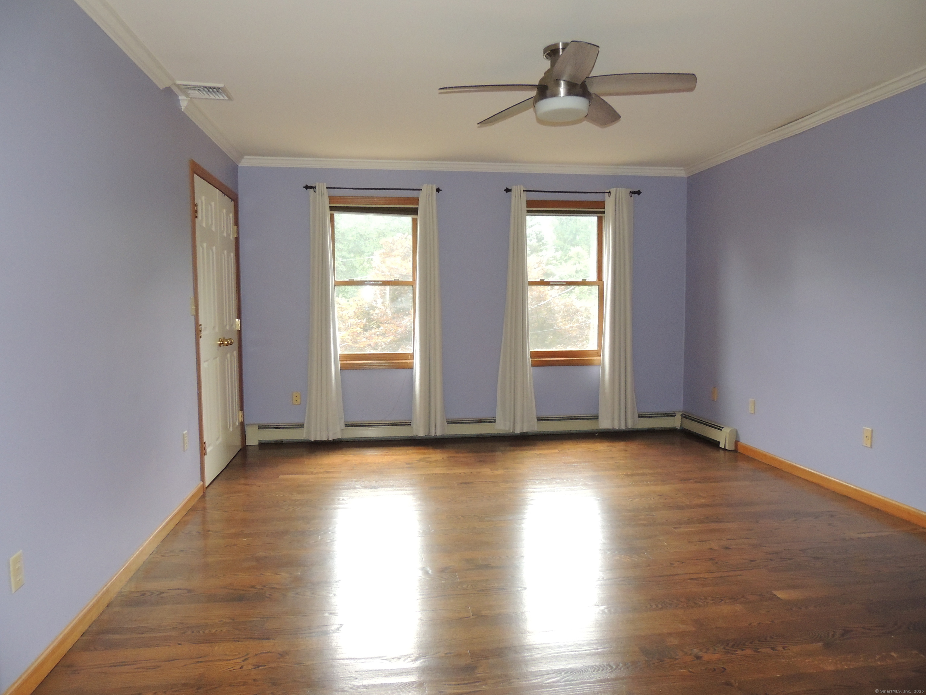 12 Cardinal Lane Monroe, CT 06468 - Photo 19 of 38 a view of room with window and wooden floor