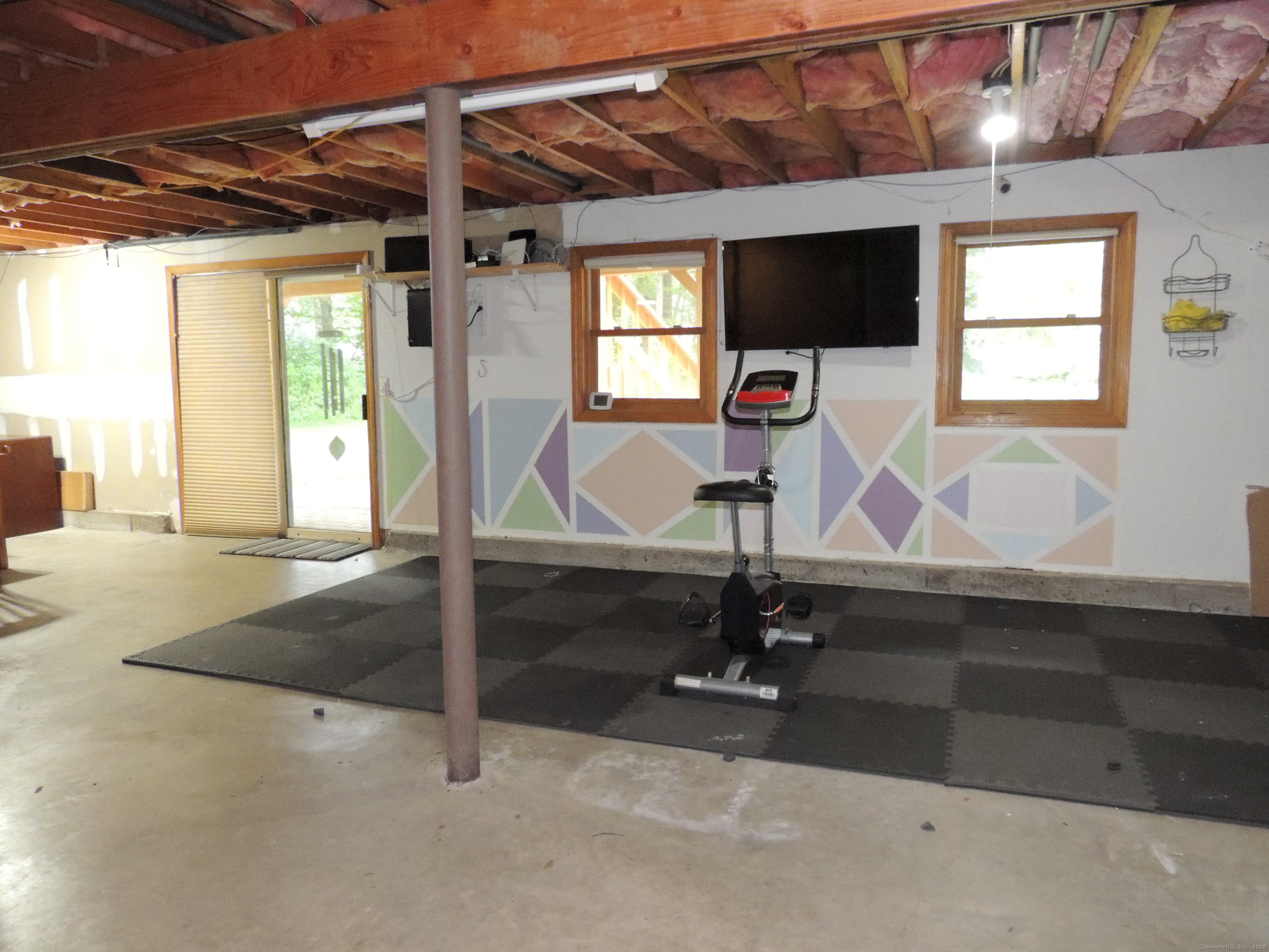 12 Cardinal Lane Monroe, CT 06468 - Photo 30 of 38 a view of a room with gym equipment