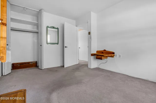 a view of room with air conditioner and closet