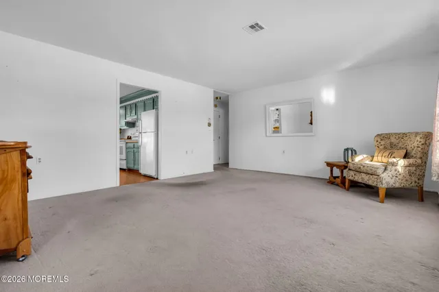 a view of livingroom with furniture and a window