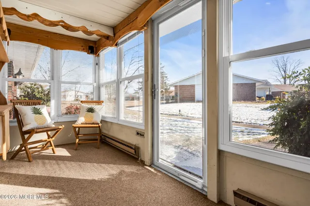 a room with furniture and large windows