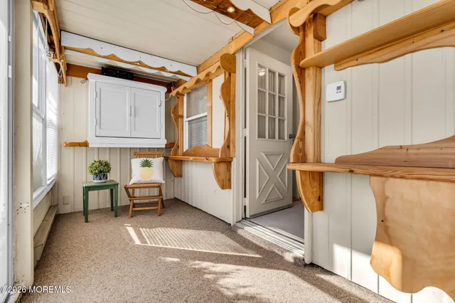 a view of a porch with furniture and a window