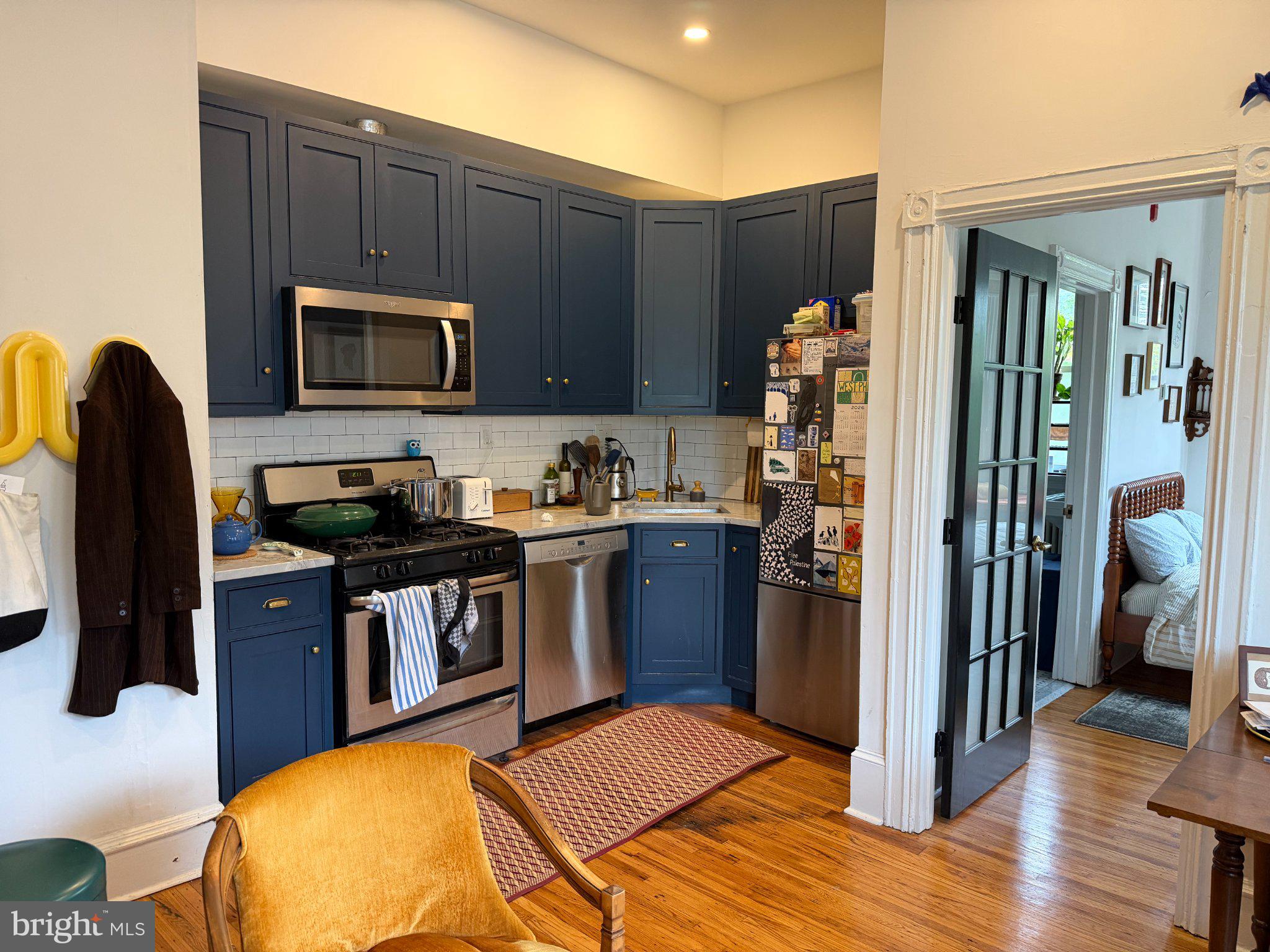 815 South 49th Street Philadelphia, PA 19143 - Photo 27 of 72 a kitchen with stainless steel appliances granite countertop a refrigerator stove top oven and sink