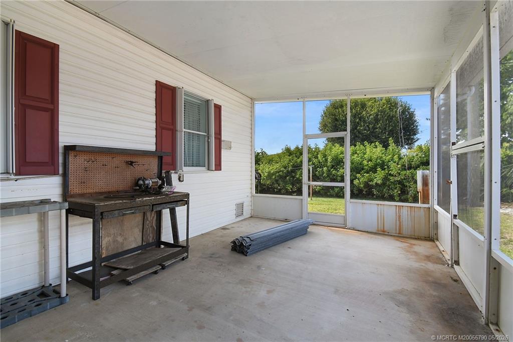 7149 Southeast Ridgeway Terrace Hobe Sound, FL 33455 - Photo 7 of 34 Spacious screened patio