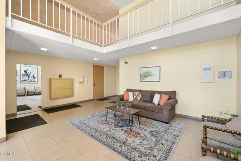 a living room with furniture and a rug