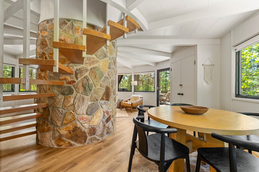 501 Gamble Road McCall, ID 83638 - Photo 12 of 28 The spiral staircase, The open spiral staircase wraps around the the stone fireplace leading to the two bedrooms.