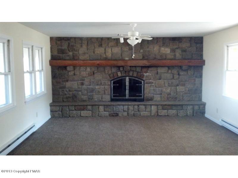 3 D Weir Road Gilbert, PA 18331 - Photo 3 of 11 a black and white photo of a livingroom