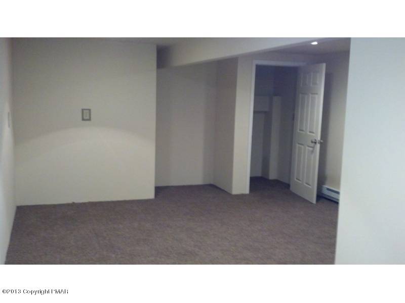 3 D Weir Road Gilbert, PA 18331 - Photo 4 of 11 a open hall with a bench