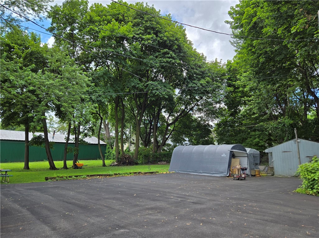 695-697 Culver Road Rochester, NY 14609 - Photo 42 of 50 There is a 1 car garage and two temporary outbuildings.