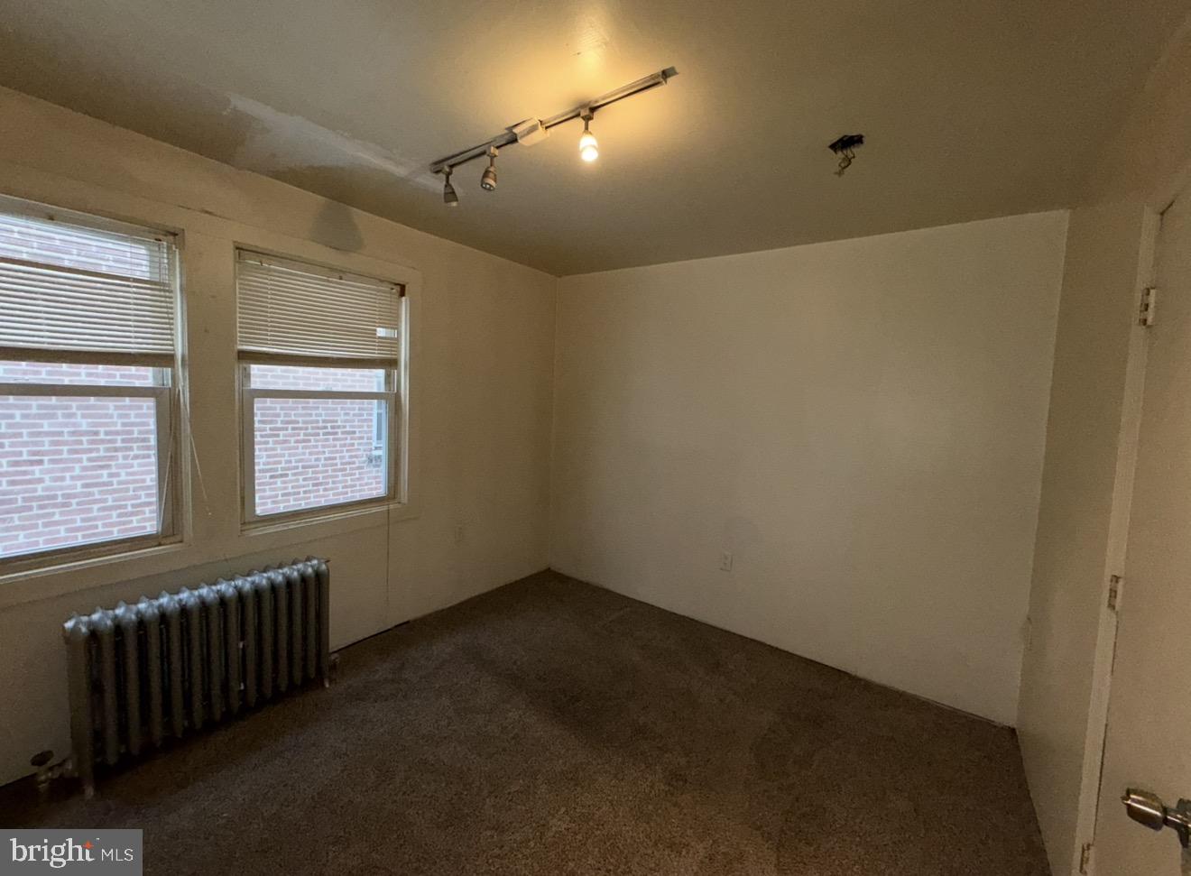 205 Marshall Avenue Darby, PA 19023 - Photo 6 of 14 a view of an empty room with a window