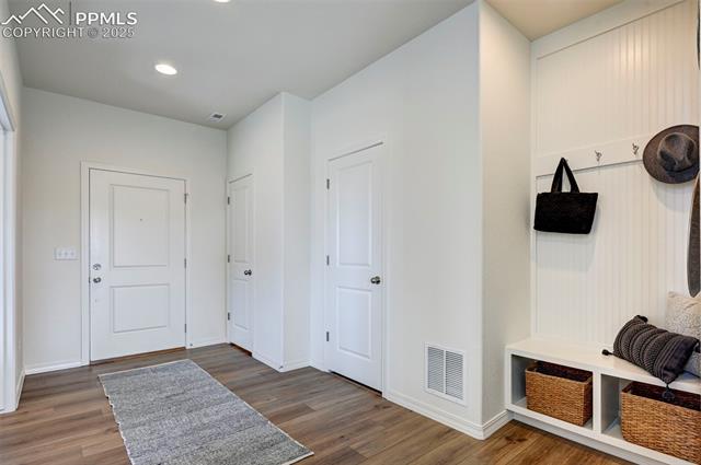 5057 Truscott Road Colorado Springs, CO 80925 - Photo 42 of 48 Mudroom with dark hardwood / wood-style flooring