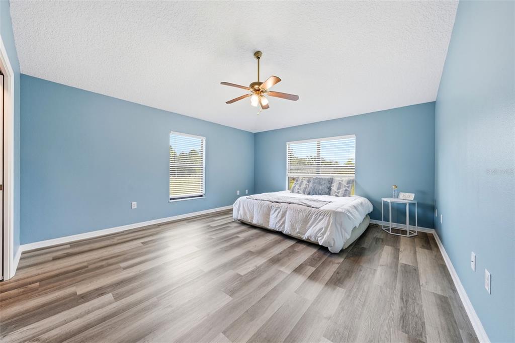 14433 Lake Yale Road Umatilla, FL 32784 - Photo 12 of 38 a bedroom with a bed and window
