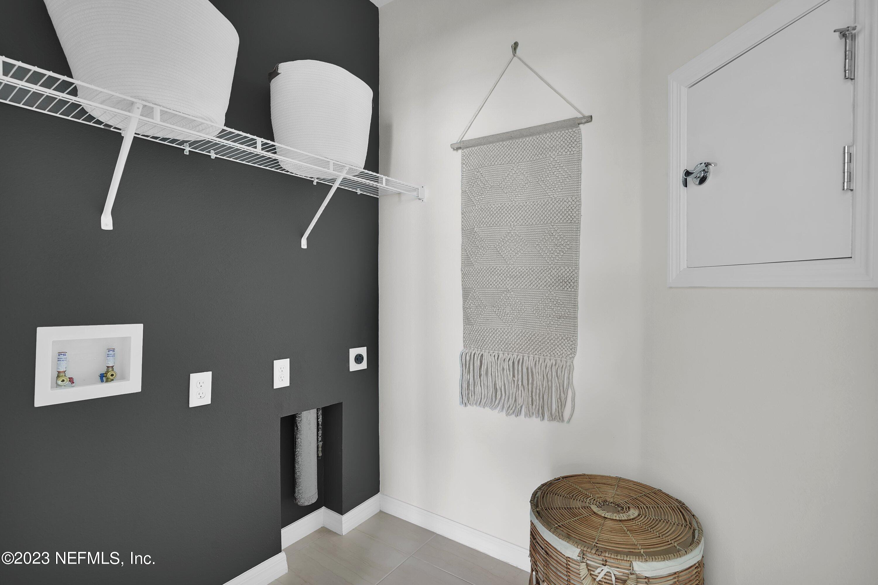 597 Continuum Loop Yulee, FL 32097 - Photo 14 of 23 a room with workbench and shower