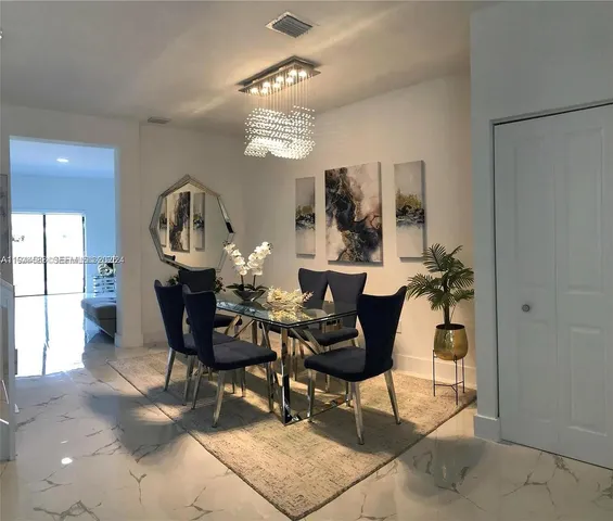 a view of a dining room with furniture
