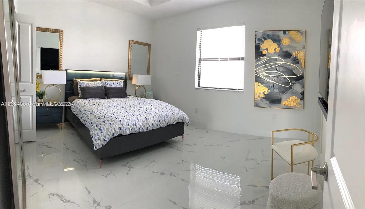 10162 Southwest 228th Terrace Miami, FL 33190 - Photo 10 of 20 a bedroom with a bed and a chair