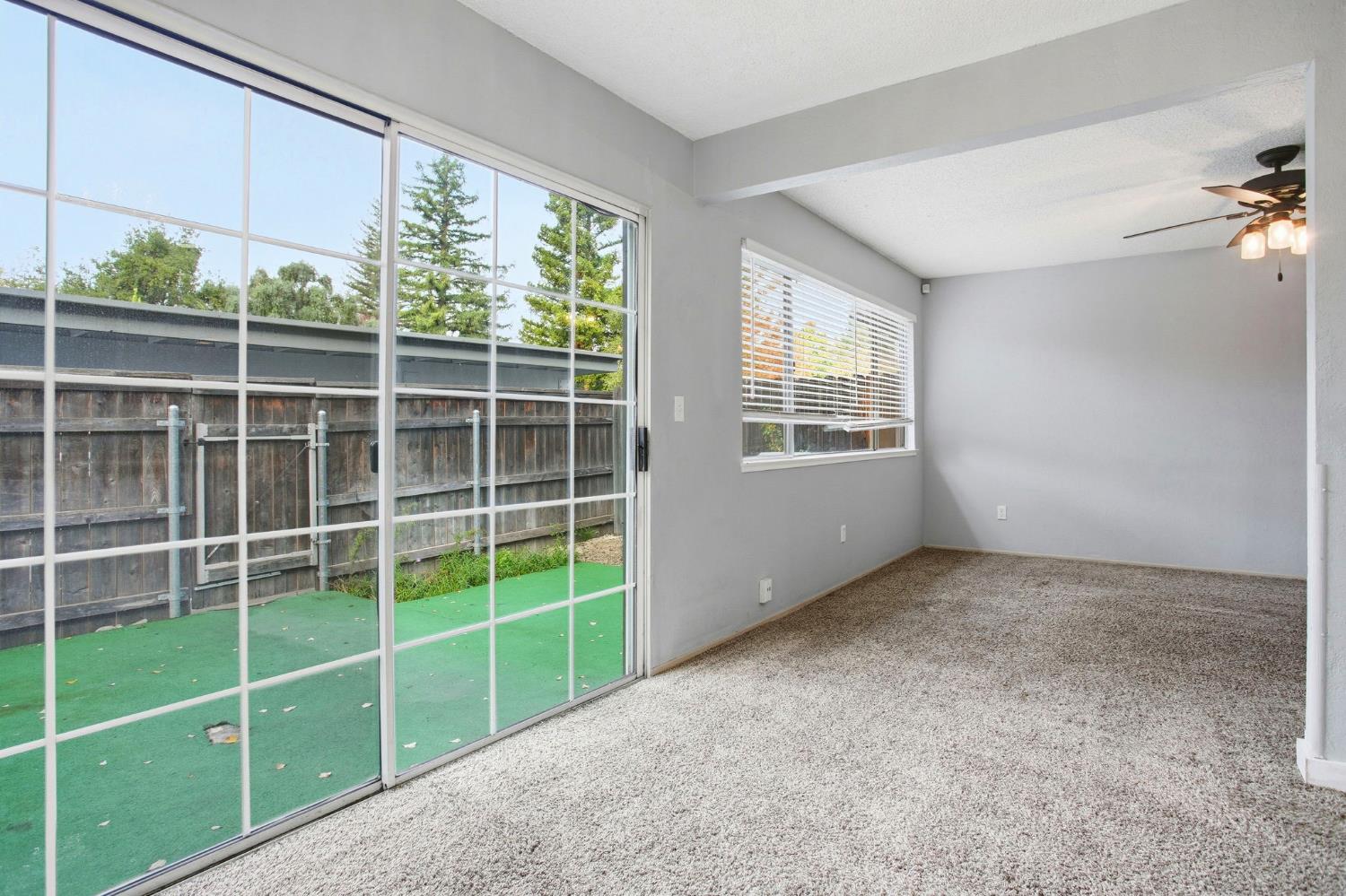 5805 Muldrow Road Sacramento, CA 95841 - Photo 12 of 28 a view of a room with a window and a ceiling fan