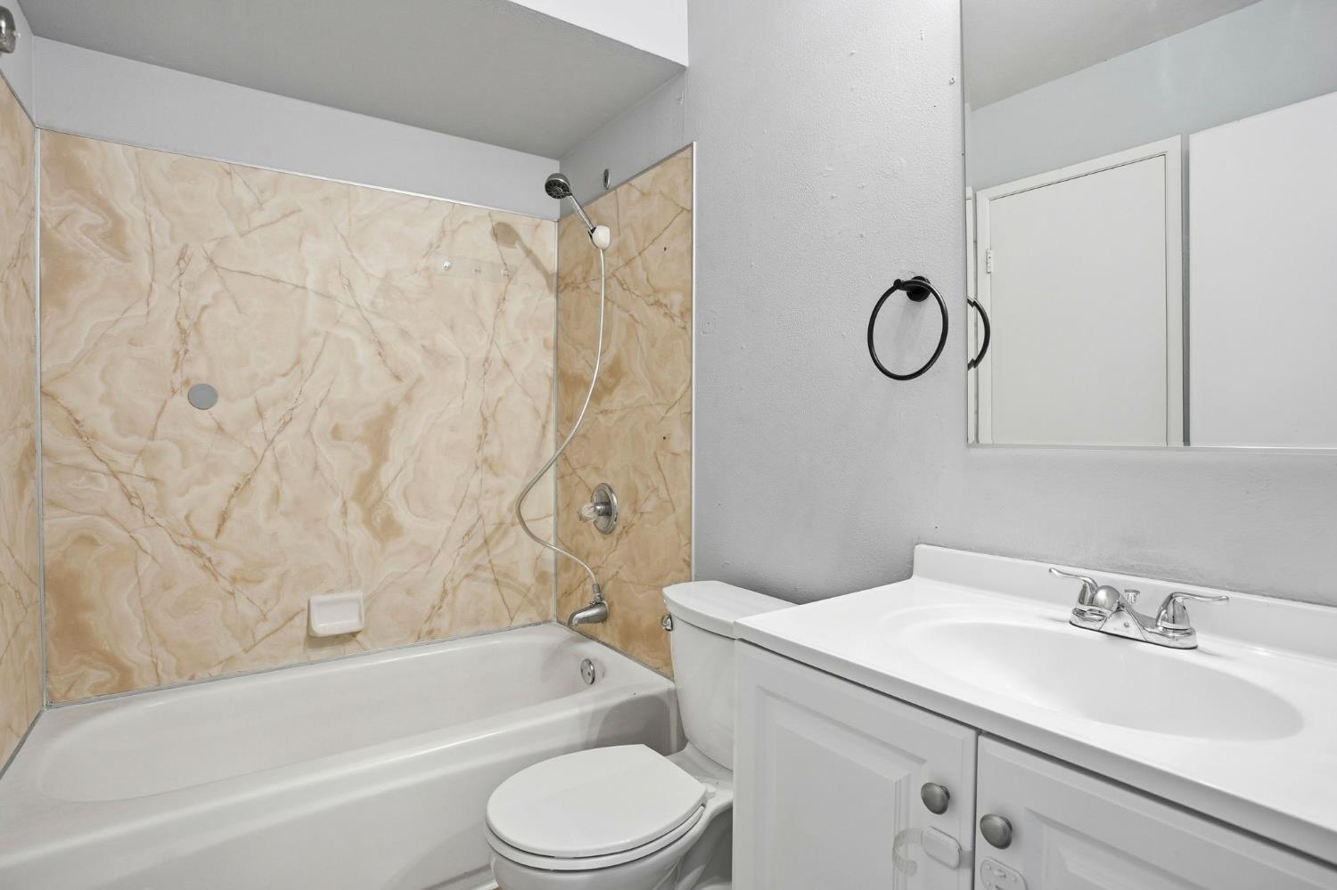 5805 Muldrow Road Sacramento, CA 95841 - Photo 15 of 28 a bathroom with a sink a toilet and a bathtub