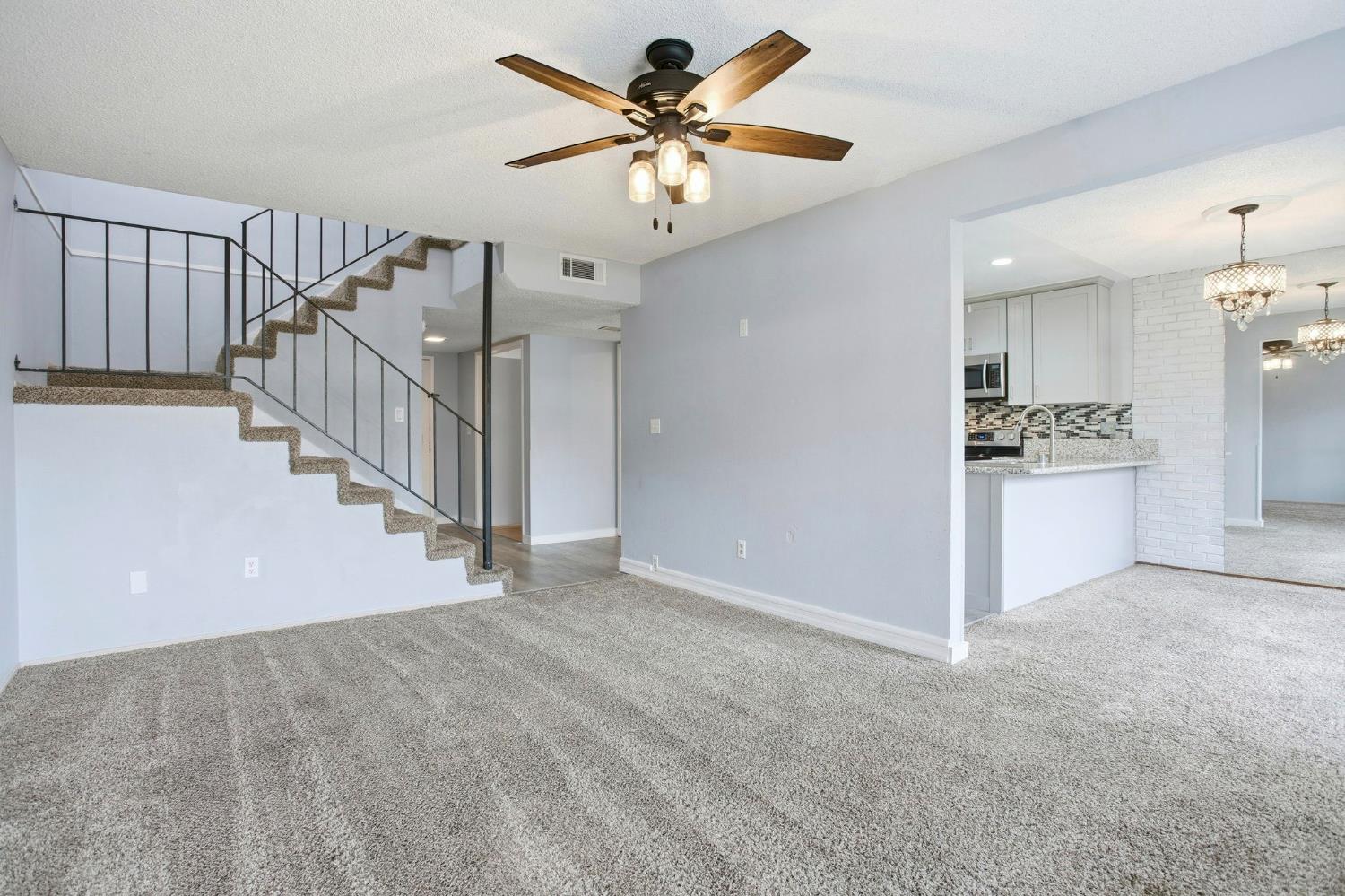 5805 Muldrow Road Sacramento, CA 95841 - Photo 2 of 28 a view of an empty room and kitchen view of a house