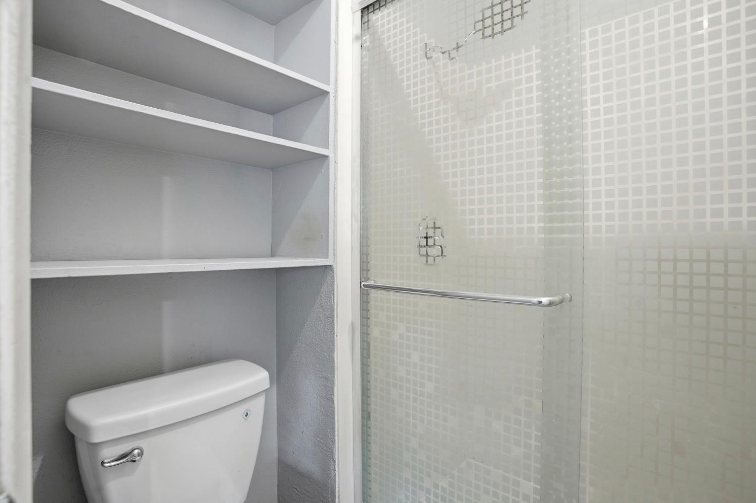 5805 Muldrow Road Sacramento, CA 95841 - Photo 22 of 28 a white toilet sitting next to a shower