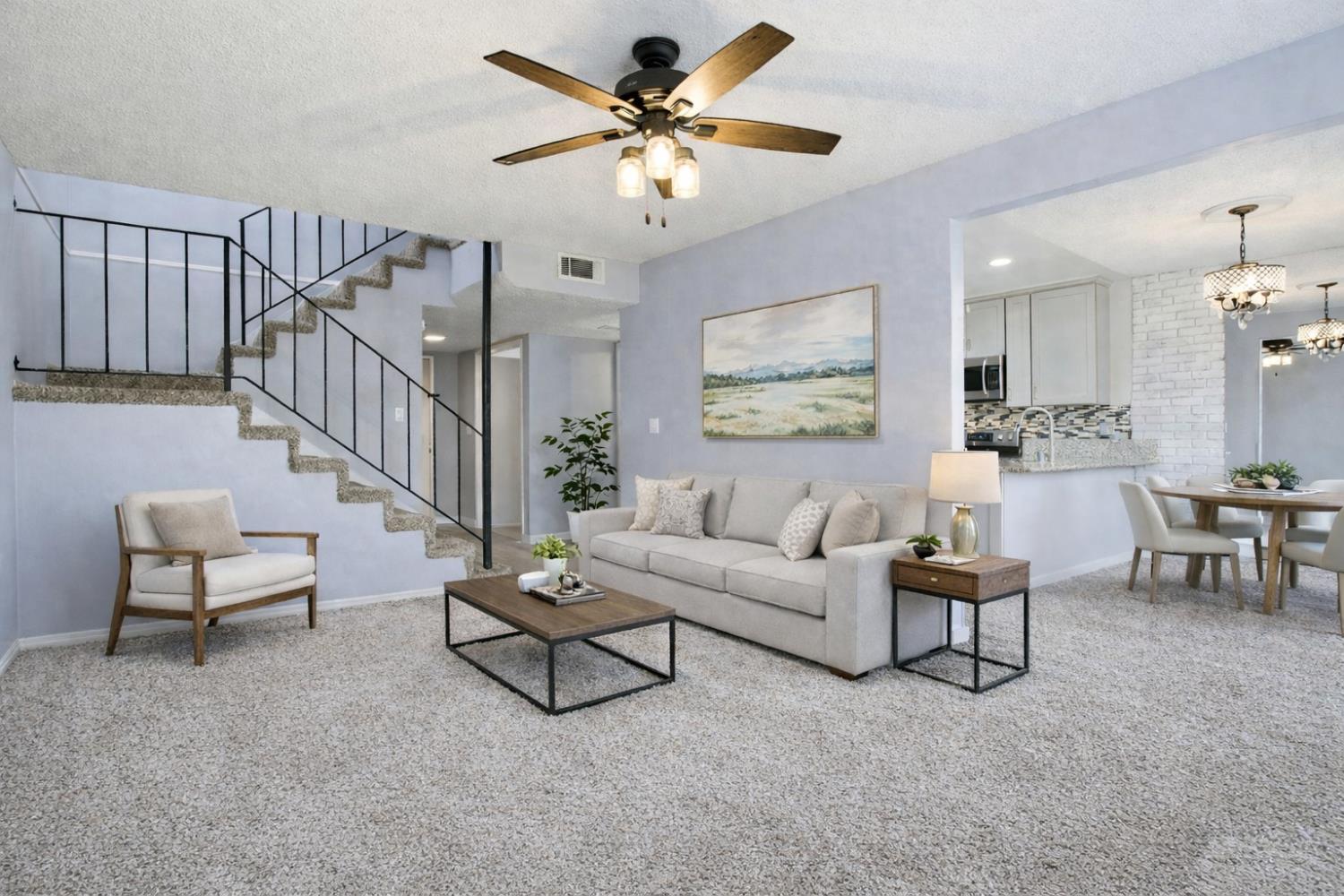 5805 Muldrow Road Sacramento, CA 95841 - Photo 6 of 28 a living room with furniture and a chandelier