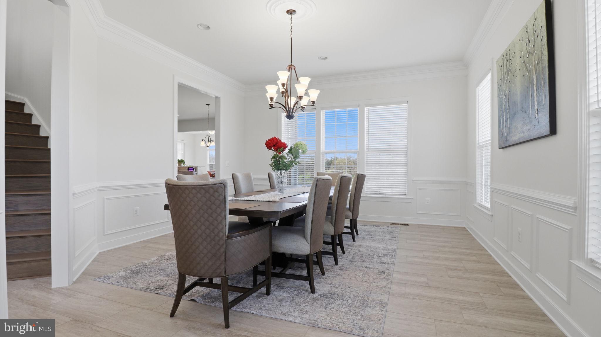 11502 Aden Road Nokesville, VA 20181 - Photo 23 of 106 a view of a dining room with furniture and chandelier