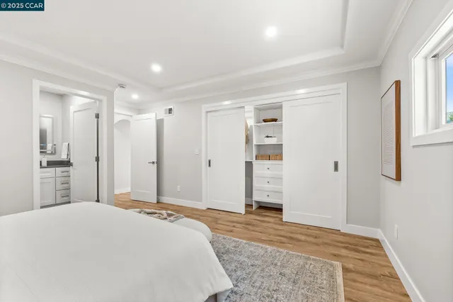 a spacious bedroom with a bed and closet