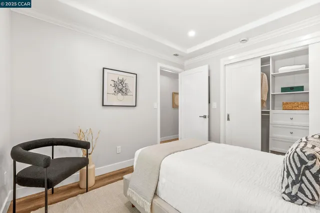 a bedroom with a bed and chair