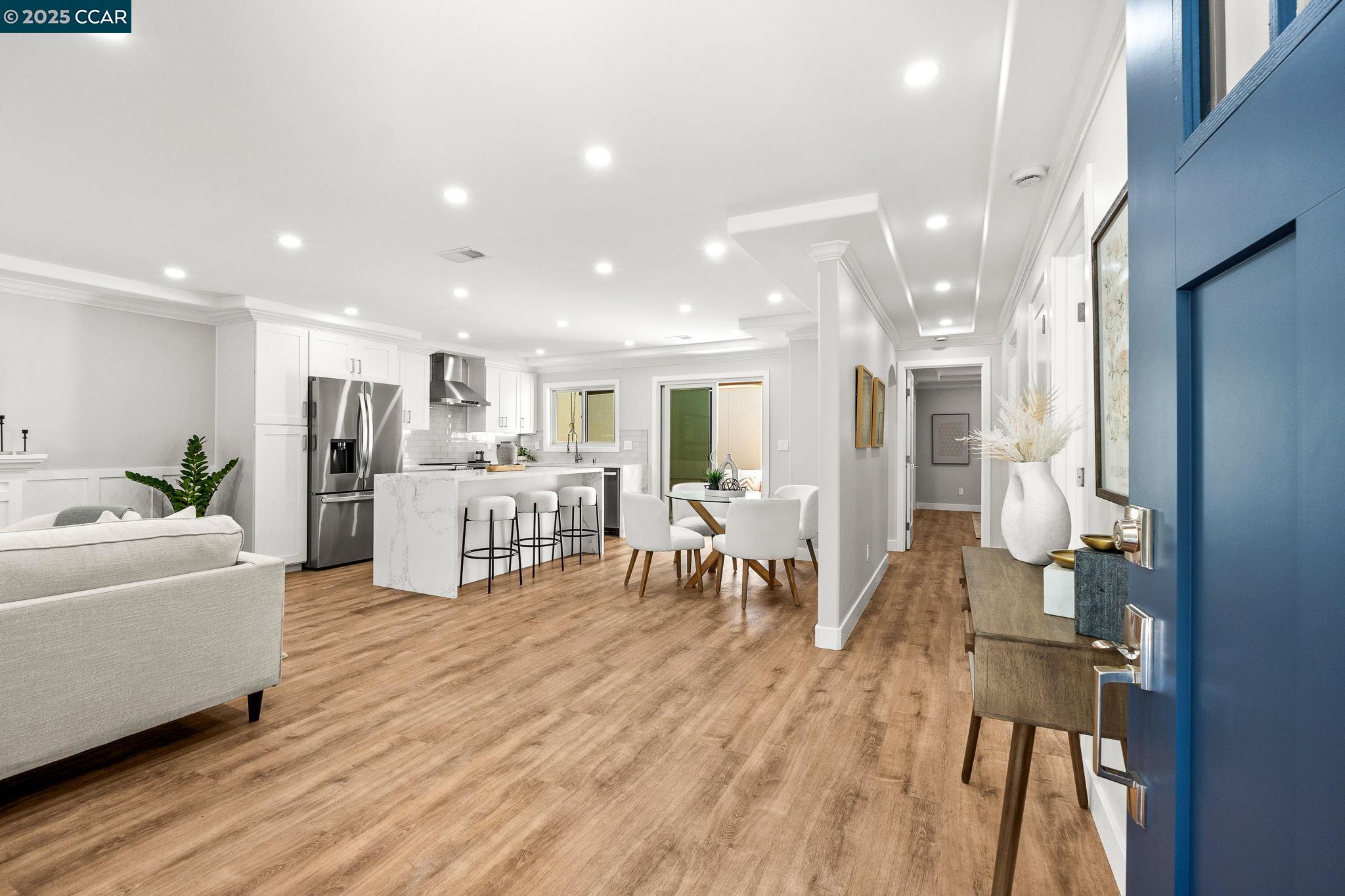 2300 Pine Knoll Drive, Unit 1 Walnut Creek, CA 94595 - Photo 17 of 46 a living room with furniture and kitchen view with wooden floor