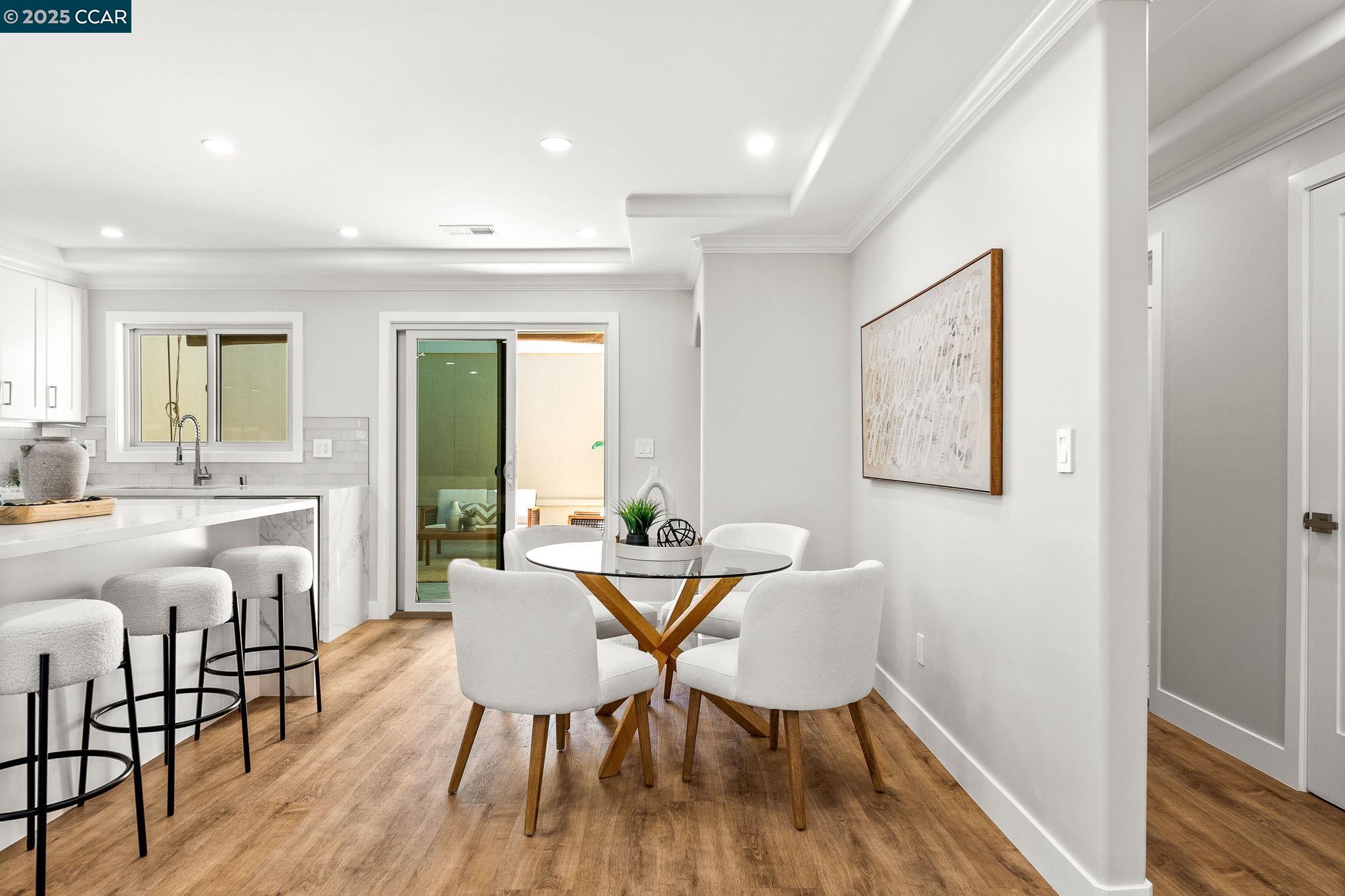 2300 Pine Knoll Drive, Unit 1 Walnut Creek, CA 94595 - Photo 23 of 46 a view of a dining room with furniture and wooden floor