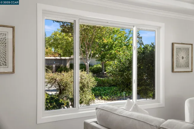 a living room with couch and a window