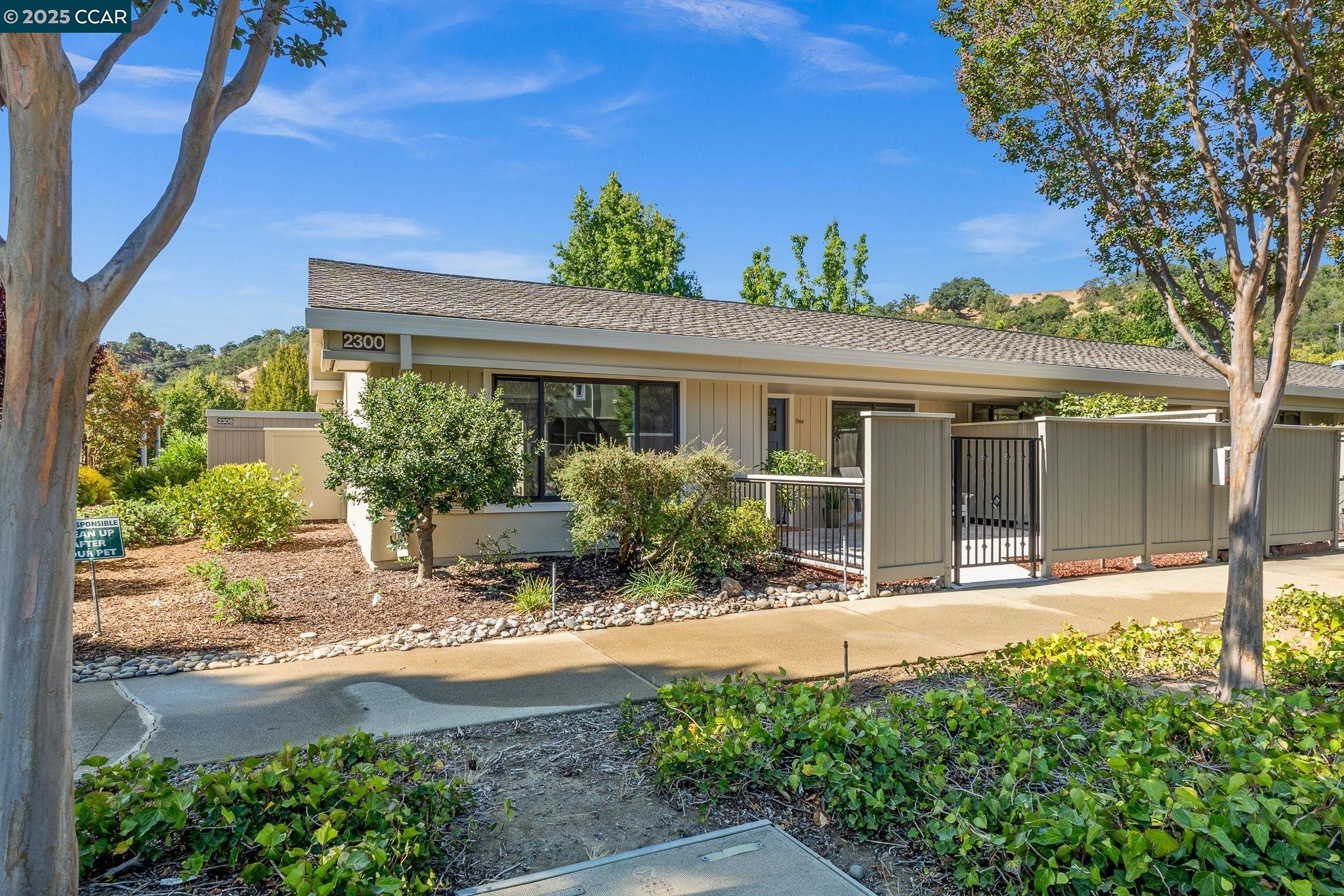 2300 Pine Knoll Drive, Unit 1 Walnut Creek, CA 94595 - Photo 39 of 46 front view of a house with a yard