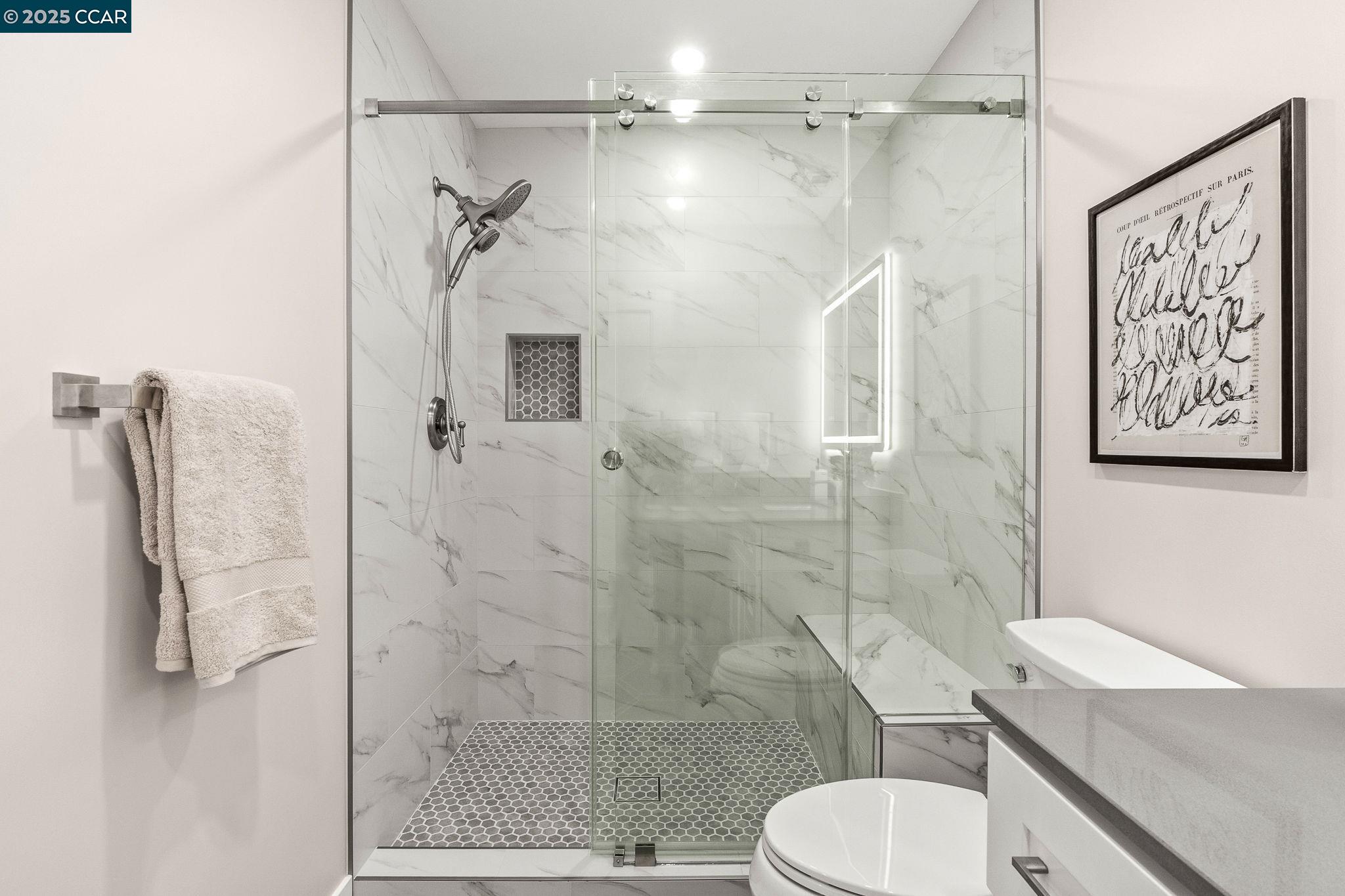 2300 Pine Knoll Drive, Unit 1 Walnut Creek, CA 94595 - Photo 4 of 46 a bathroom with a sink toilet and shower