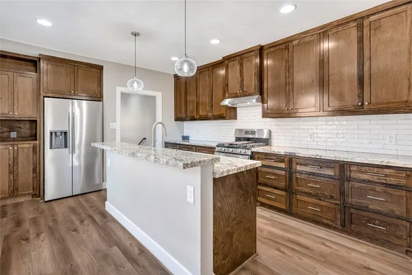 a bathroom with double vanity sink and a mirror