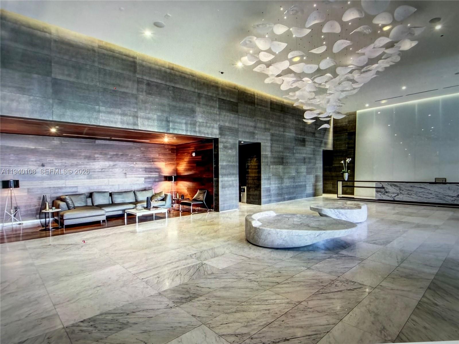 68 Southeast 6th Street, Unit 3708 Miami, FL 33131 - Photo 16 of 17 a view of a room with gym equipment