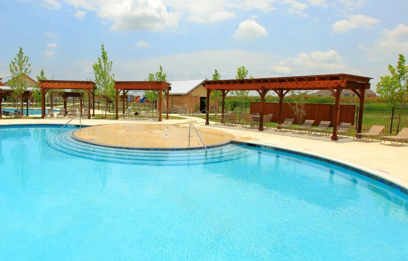 1000 Bright Star Cove Georgetown, TX 78628 - Photo 36 of 40 a swimming pool with outdoor seating and yard in the back