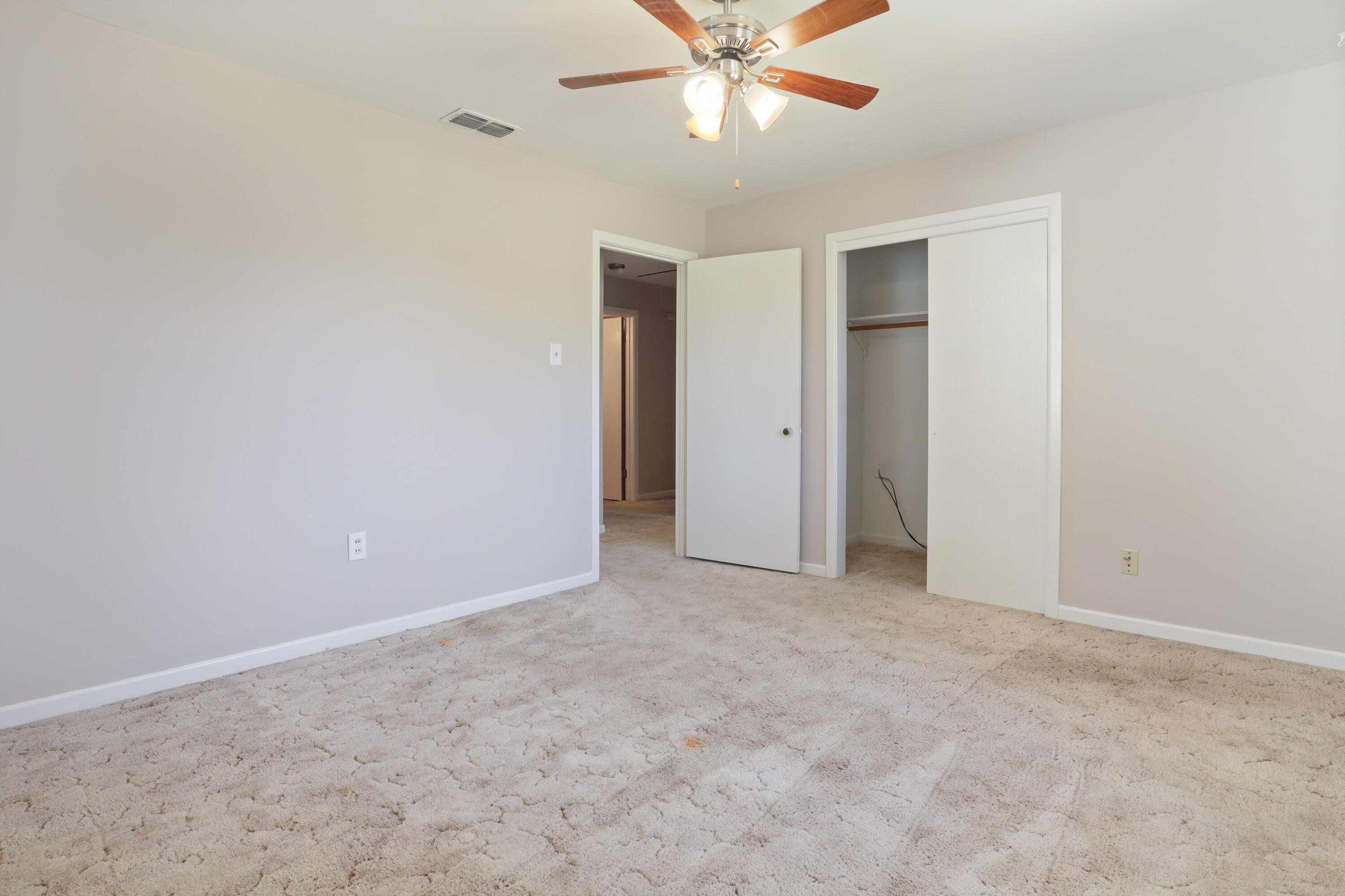 511 6th Street Wolfforth, TX 79382 - Photo 16 of 26 a view of an empty room with a fan