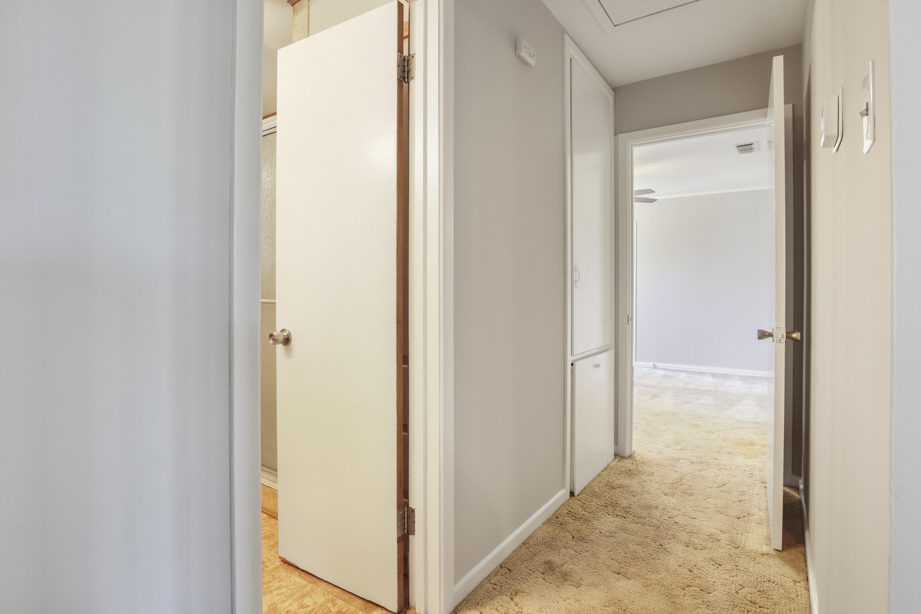 511 6th Street Wolfforth, TX 79382 - Photo 18 of 26 a view of a bathroom from a corridor