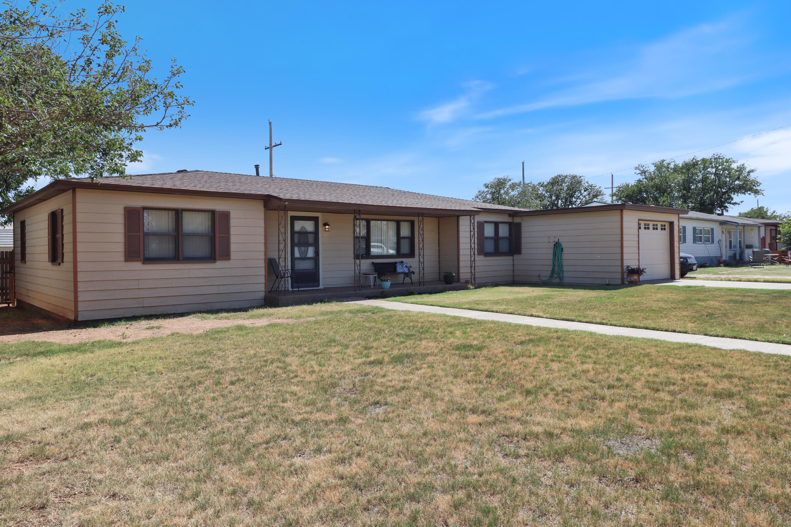 511 6th Street Wolfforth, TX 79382 - Photo 2 of 26 a front view of a house with a yard