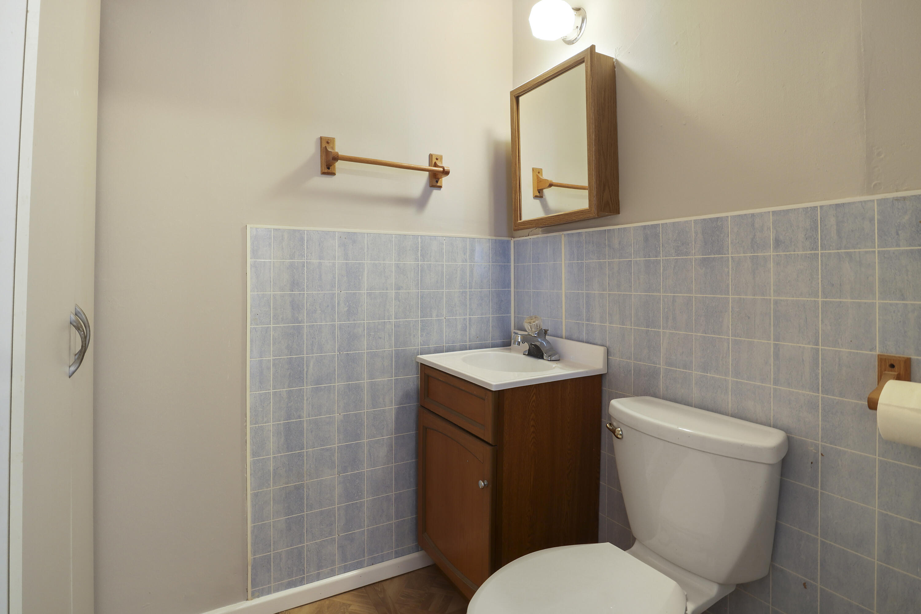 511 6th Street Wolfforth, TX 79382 - Photo 24 of 26 a white toilet sitting next to a bathroom sink