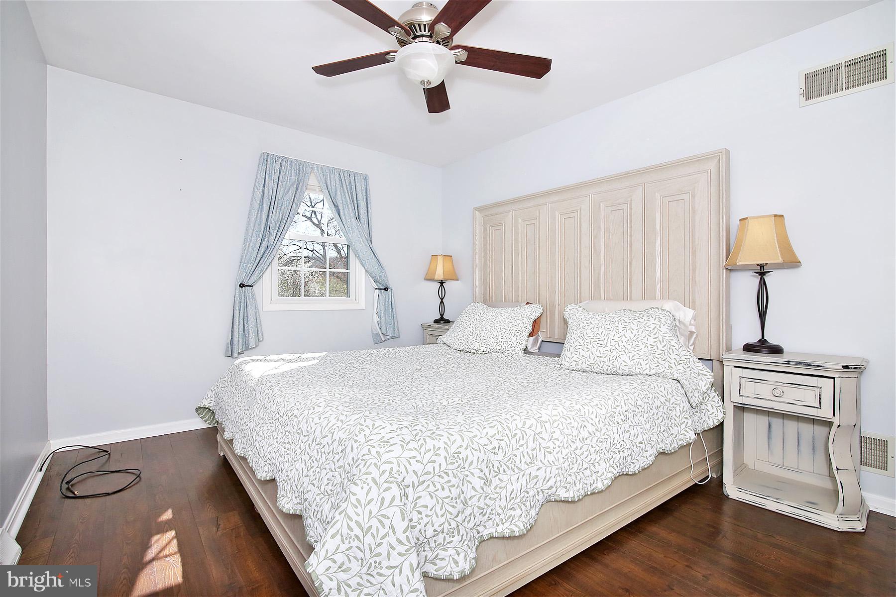 77 East Mohler Church Road Ephrata, PA 17522 - Photo 18 of 35 a bedroom with a bed a window and a chandelier
