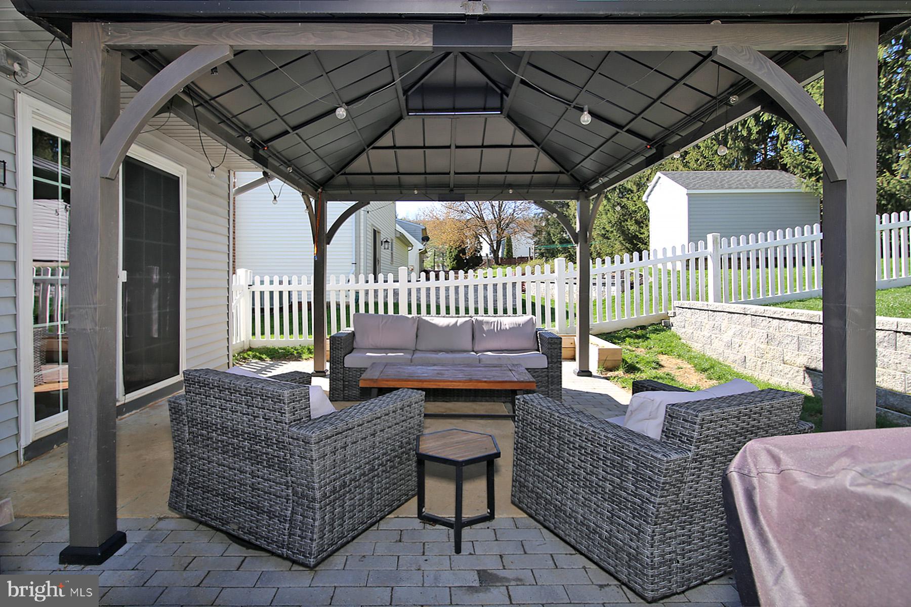 77 East Mohler Church Road Ephrata, PA 17522 - Photo 28 of 35 a view of outdoor sitting area with furniture and umbrella