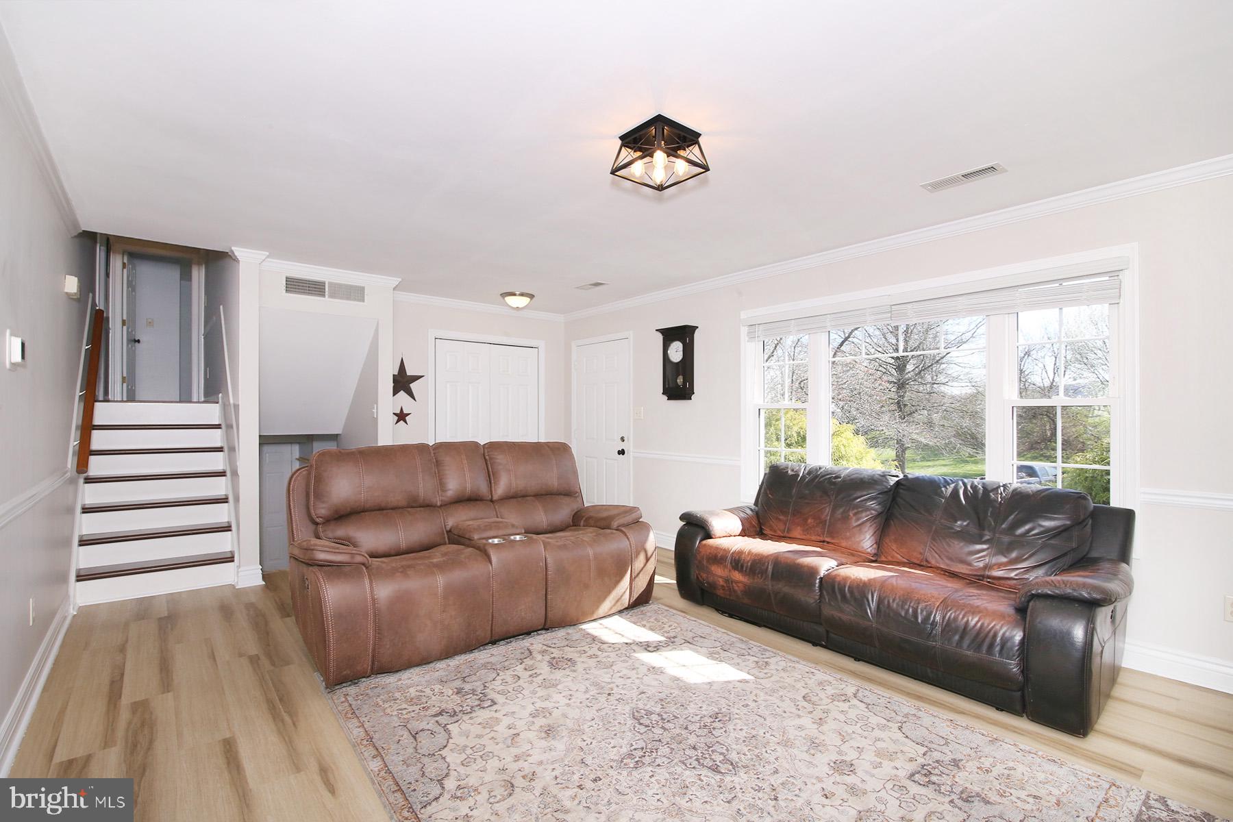 77 East Mohler Church Road Ephrata, PA 17522 - Photo 3 of 35 a living room with a couch and a wooden floor