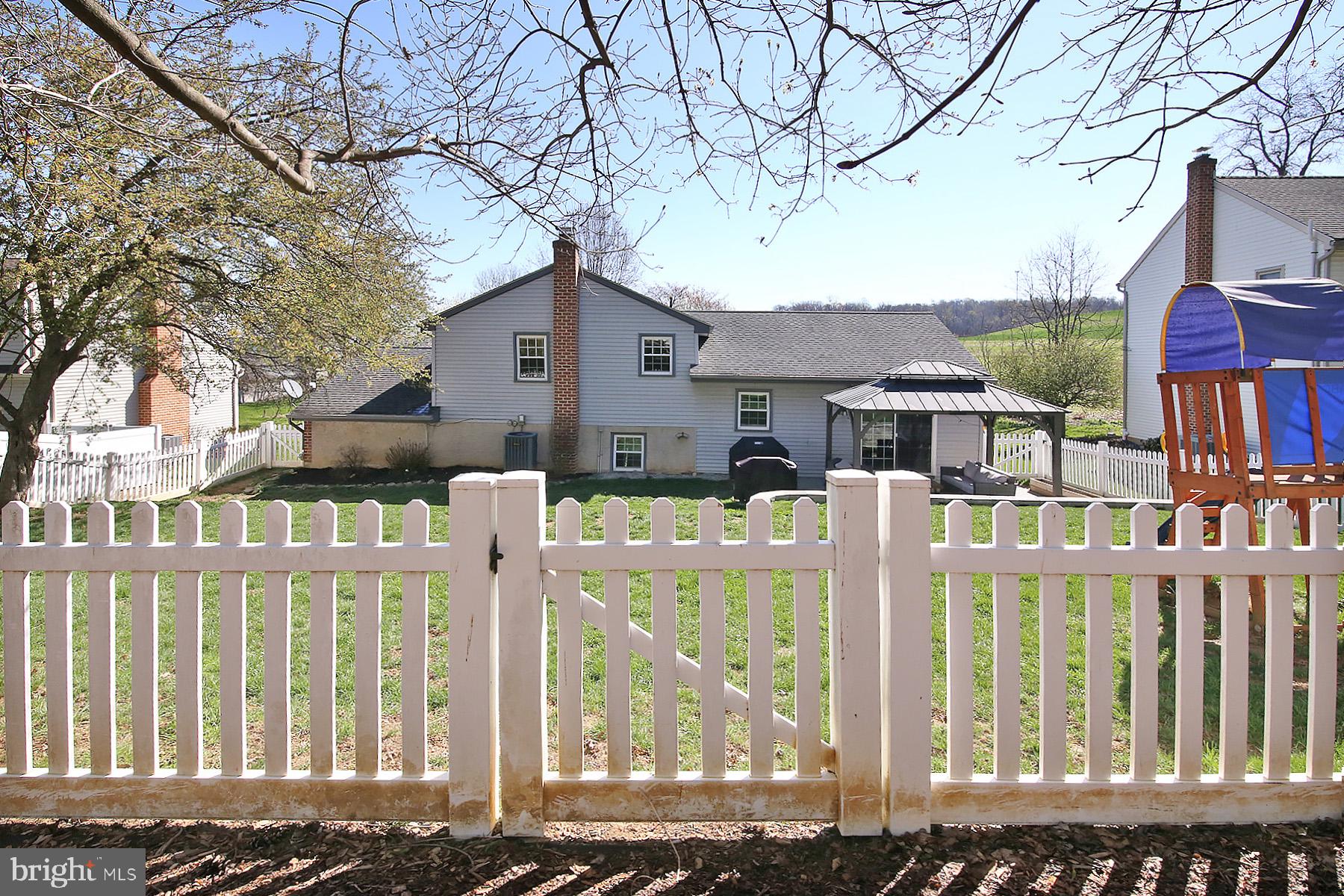 77 East Mohler Church Road Ephrata, PA 17522 - Photo 33 of 35 a front view of a house with a iron fence