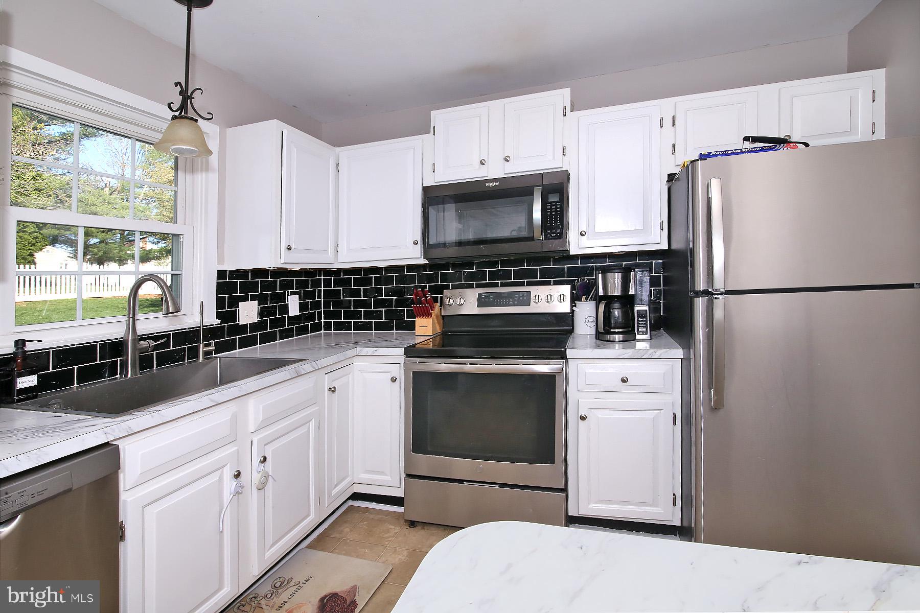 77 East Mohler Church Road Ephrata, PA 17522 - Photo 8 of 35 a kitchen with white cabinets and white appliances