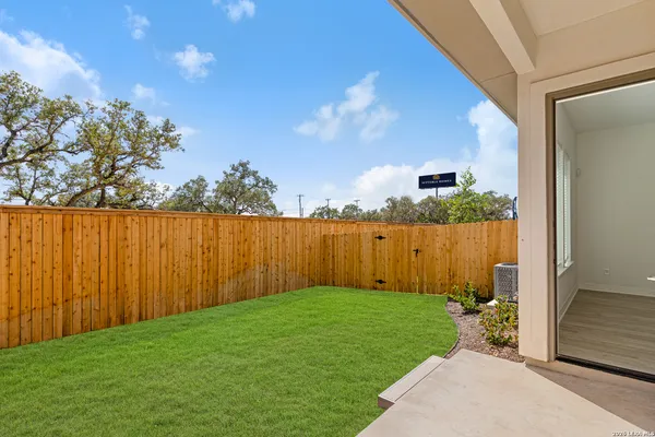 a view of a backyard with pathway