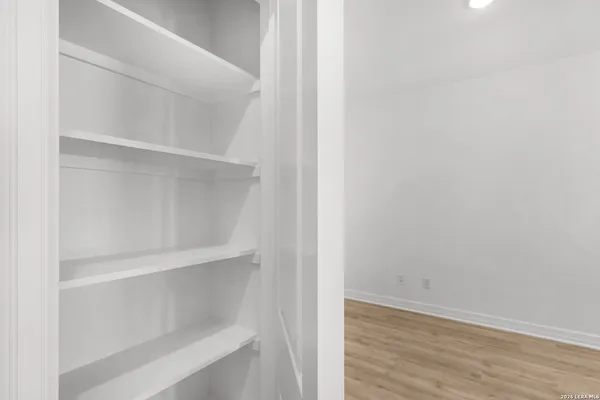 a view of an empty walk in closet